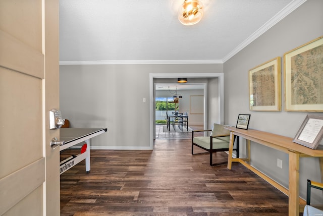 interior space with dark wood-style floors, a textured ceiling, baseboards, and crown molding