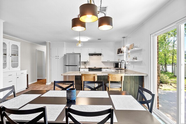 dining room featuring baseboards