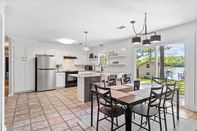 dining room with stone finish flooring and visible vents