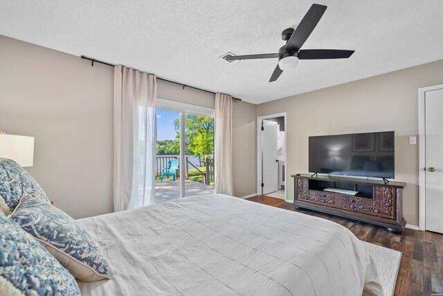 bedroom featuring access to exterior, ceiling fan, a textured ceiling, wood finished floors, and baseboards