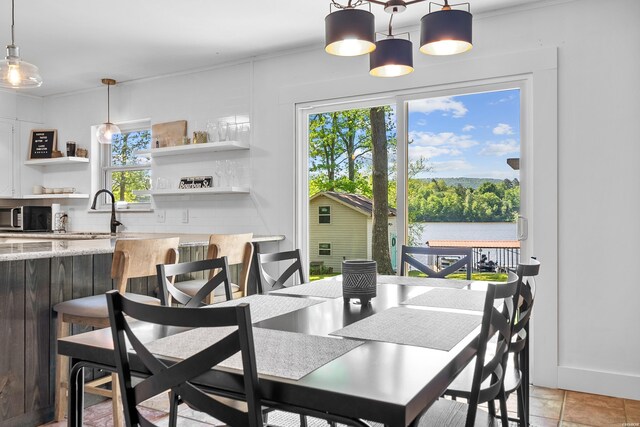 dining space with a water view