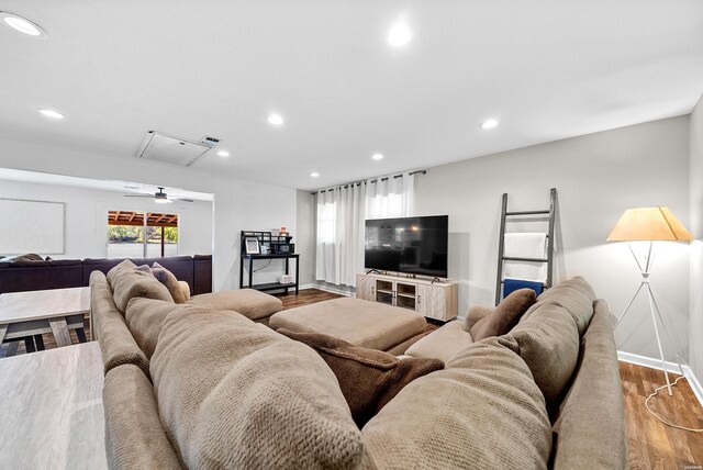 living room featuring recessed lighting, visible vents, baseboards, light wood finished floors, and attic access