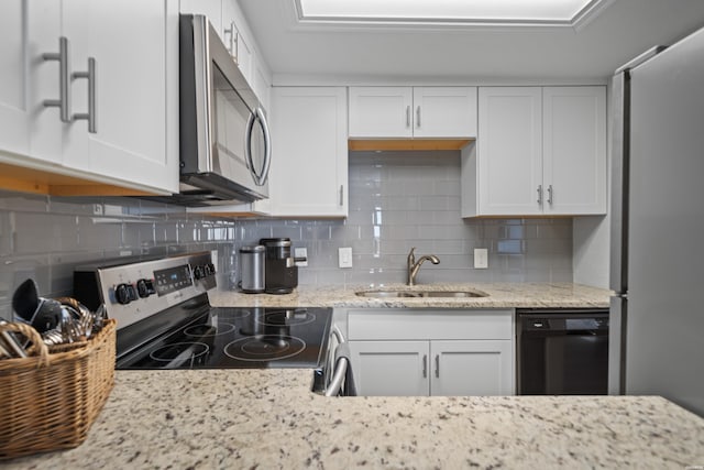 203 Stearns Pt Unit F3, Hot Springs, AR 71913 - kitchen featuring appliances with stainless steel finishes, a sink, white cabinetry, and backsplash