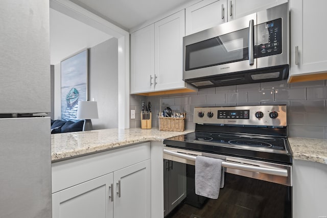 203 Stearns Pt Unit F3, Hot Springs, AR 71913 - kitchen featuring stainless steel appliances, white cabinets, and backsplash