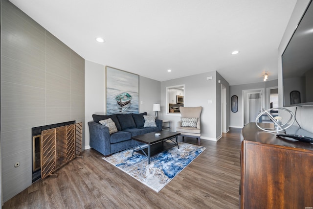 203 Stearns Pt Unit F3, Hot Springs, AR 71913 - living area with wood finished floors, baseboards, a tiled fireplace, and recessed lighting