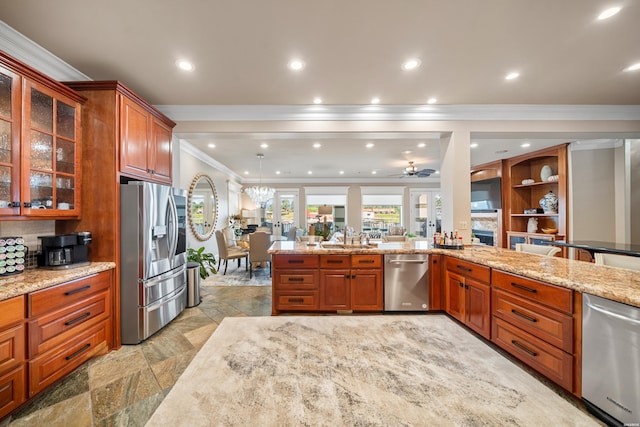 347 Paradise Pt, Hot Springs, AR 71913 - kitchen featuring stainless steel appliances, crown molding, light stone counters, glass insert cabinets, and brown cabinets