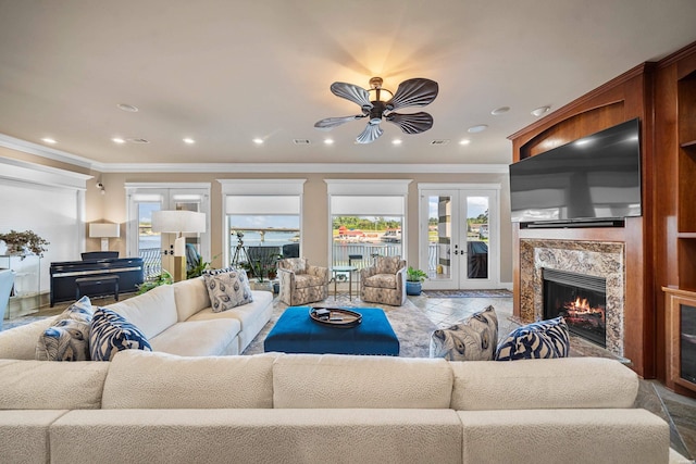 347 Paradise Pt, Hot Springs, AR 71913 - living room with french doors, healthy amount of natural light, ornamental molding, a ceiling fan, and a premium fireplace