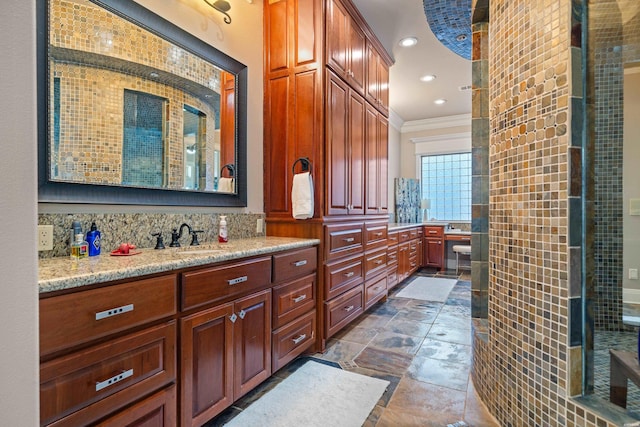 347 Paradise Pt, Hot Springs, AR 71913 - bathroom featuring vanity, stone tile flooring, crown molding, recessed lighting, and decorative backsplash