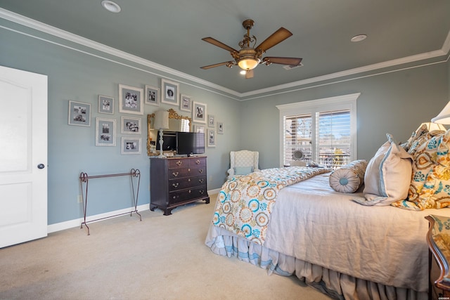 carpeted bedroom with a ceiling fan, baseboards, and ornamental molding