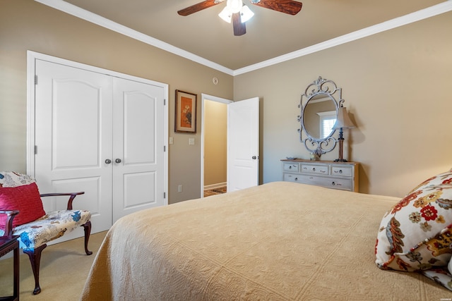 bedroom featuring a closet, crown molding, and a ceiling fan