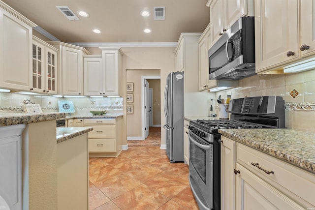 kitchen featuring visible vents, stainless steel appliances, glass insert cabinets, and light stone countertops