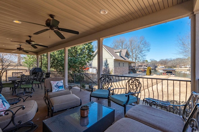 view of patio with an outdoor living space, outdoor dining area, a residential view, and ceiling fan