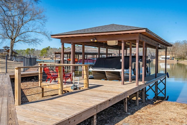 dock area featuring a water view and boat lift