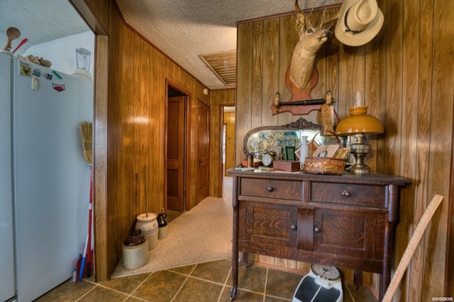 144A Isaac Ln, Hot Springs, AR 71901 - corridor with a textured ceiling, wood walls, tile patterned flooring, and ornamental molding