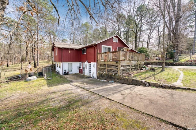144A Isaac Ln, Hot Springs, AR 71901 - view of property exterior featuring a deck and a lawn