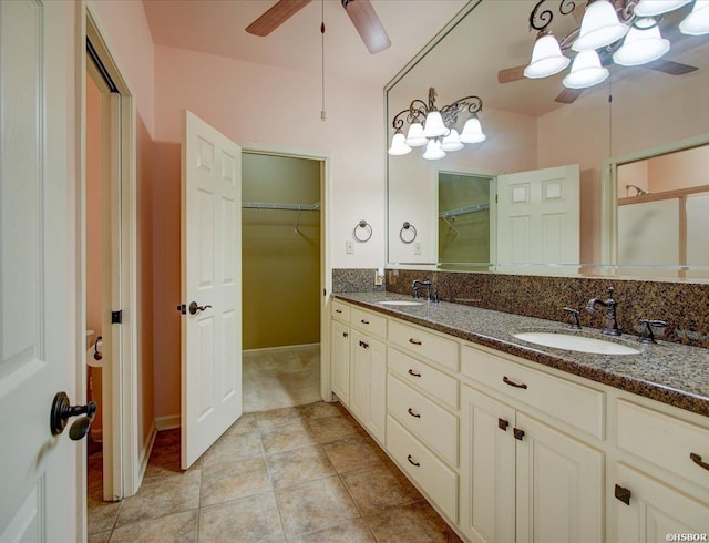 217 Paradise Pt, Hot Springs, AR 71913 - full bathroom with a ceiling fan, double vanity, a spacious closet, and tile patterned flooring
