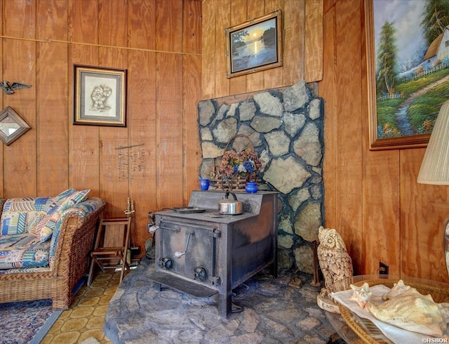 details with a wood stove and wooden walls