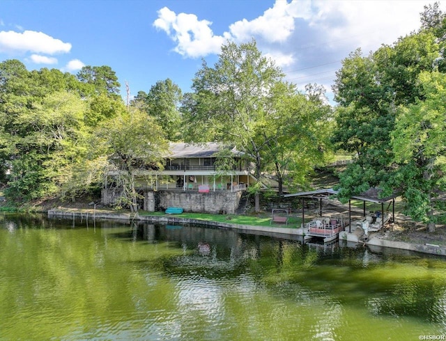 view of dock with a deck with water view and stairs