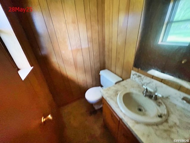 501 N Byrd St, Crossett, AR 71635 - half bath with vanity, toilet, and wooden walls