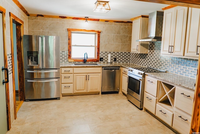 114 Roy Cir, Monticello, AR 71655 - kitchen featuring appliances with stainless steel finishes, a sink, wall chimney range hood, tasteful backsplash, and light stone countertops