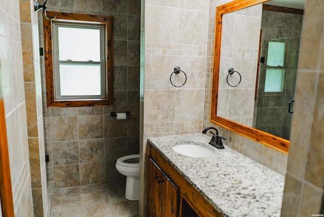 114 Roy Cir, Monticello, AR 71655 - full bathroom with tile walls, vanity, toilet, tasteful backsplash, and a shower with door