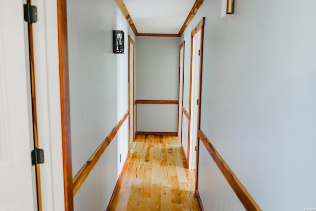 114 Roy Cir, Monticello, AR 71655 - hall with an upstairs landing, light wood-style flooring, and ornamental molding