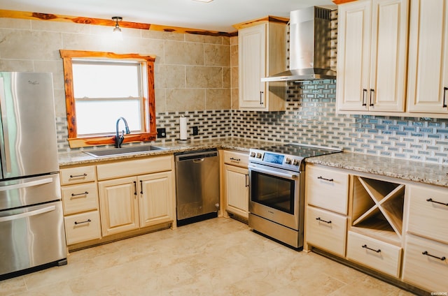 114 Roy Cir, Monticello, AR 71655 - kitchen with stainless steel appliances, wall chimney range hood, a sink, backsplash, and light brown cabinets