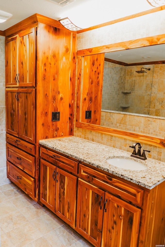 114 Roy Cir, Monticello, AR 71655 - full bath with vanity, tasteful backsplash, tile patterned floors, and a shower