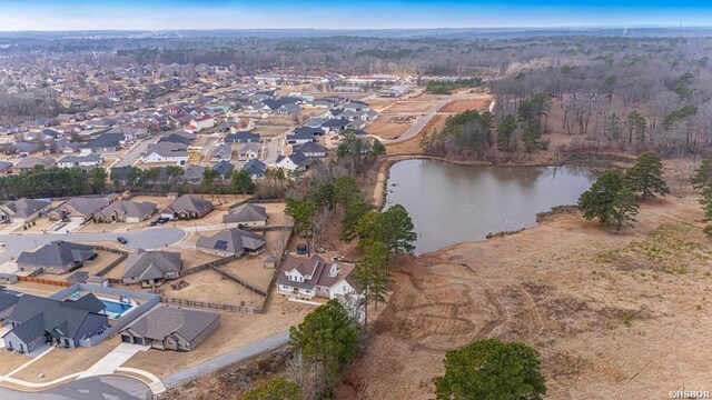 birds eye view of property featuring a water view and a residential view