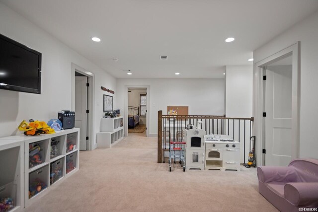 playroom featuring recessed lighting, light carpet, and visible vents