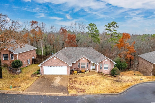 view of front of house featuring a garage, brick siding, fence, concrete driveway, and roof with shingles