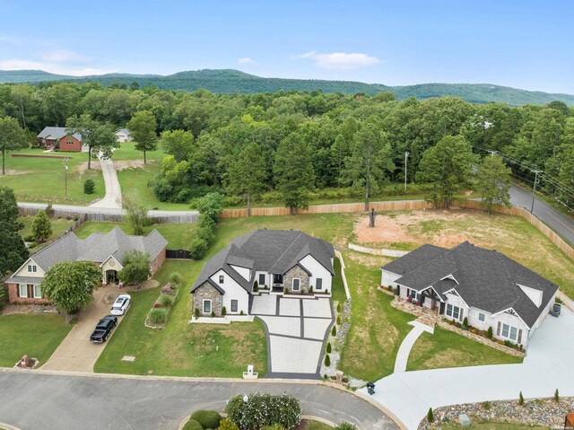 birds eye view of property with a wooded view and a residential view