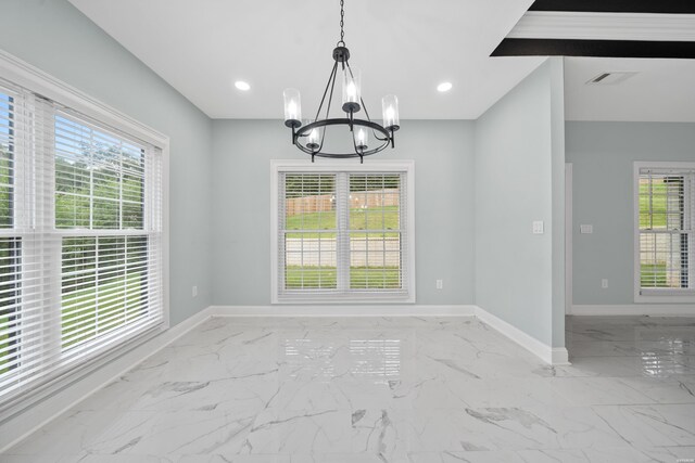 unfurnished dining area featuring a healthy amount of sunlight, marble finish floor, and visible vents