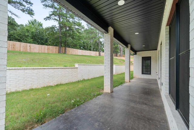 view of patio / terrace featuring fence