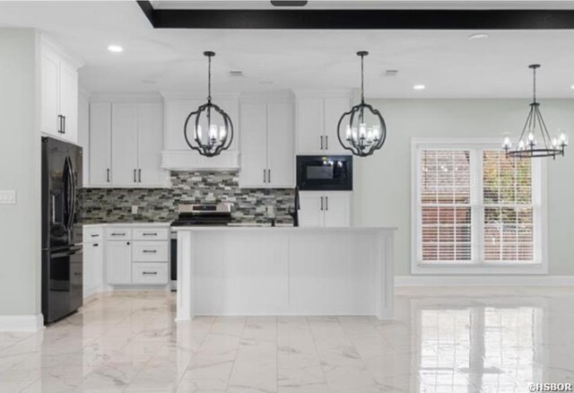 kitchen with pendant lighting, white cabinets, black appliances, and an inviting chandelier