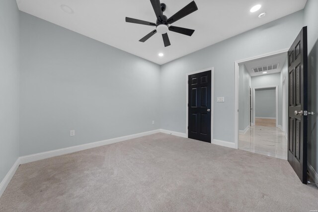 unfurnished bedroom with baseboards, recessed lighting, visible vents, and light colored carpet