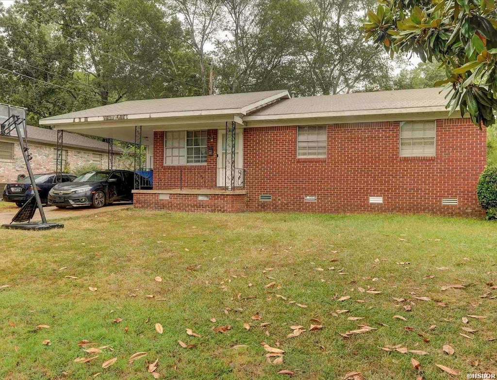 single story home with a carport, brick siding, crawl space, and a front yard