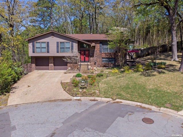 9925 Echo Valley Ct, Little Rock, AR 72227 - bi-level home with brick siding, driveway, a garage, and a front yard