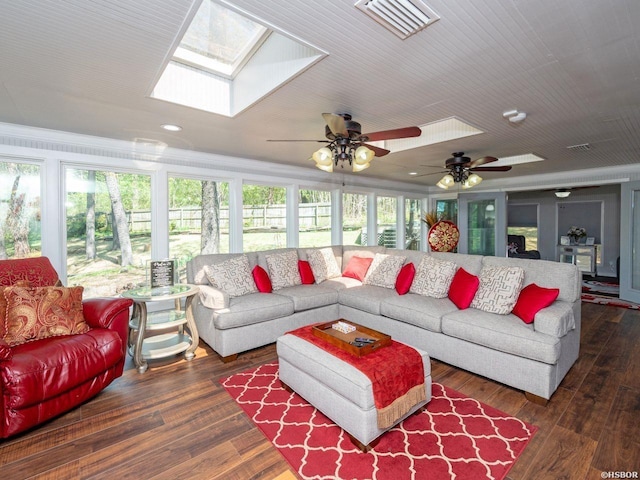 9925 Echo Valley Ct, Little Rock, AR 72227 - living area featuring healthy amount of natural light, a skylight, recessed lighting, a ceiling fan, and wood finished floors