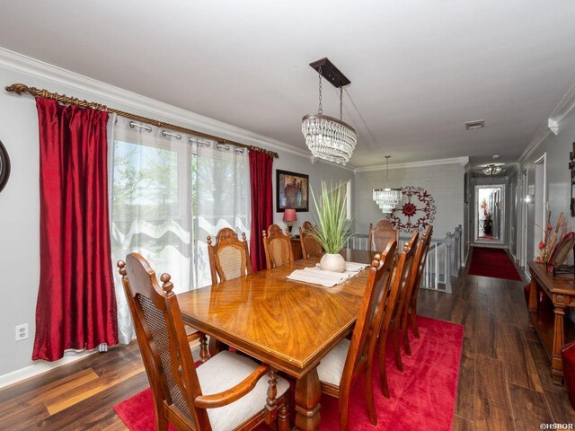 9925 Echo Valley Ct, Little Rock, AR 72227 - dining area with a chandelier, crown molding, and wood finished floors