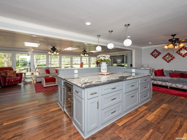 9925 Echo Valley Ct, Little Rock, AR 72227 - kitchen with open floor plan, wine cooler, dark wood-style flooring, ceiling fan, and crown molding