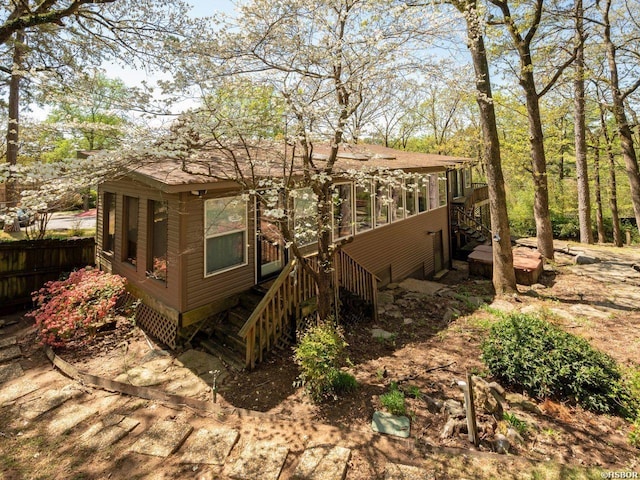 9925 Echo Valley Ct, Little Rock, AR 72227 - view of home's exterior featuring stairway and a sunroom