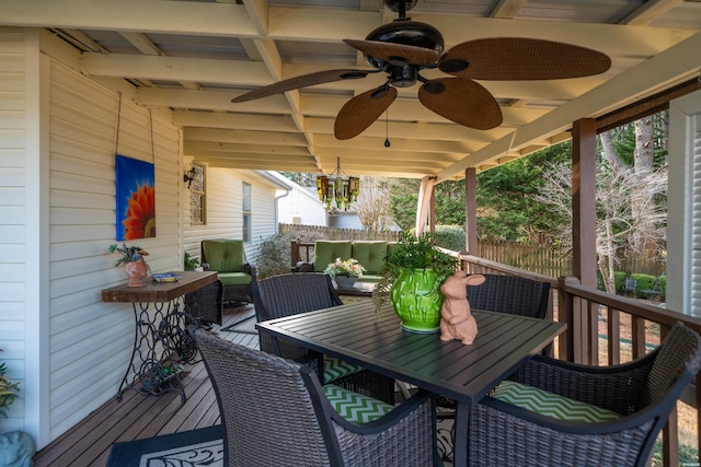 deck featuring ceiling fan, fence, outdoor dining area, and an outdoor living space