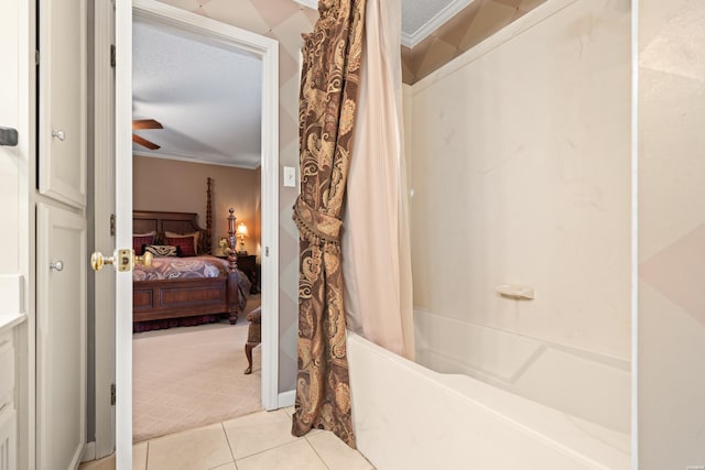 full bathroom featuring shower / tub combo, ceiling fan, tile patterned floors, a textured ceiling, and crown molding