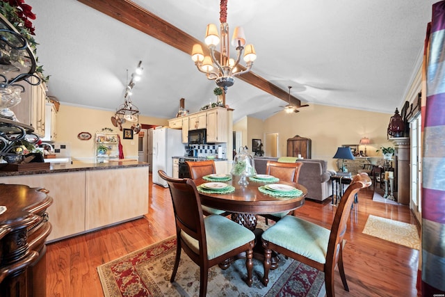 dining room with ornamental molding, light wood-type flooring, lofted ceiling with beams, and ceiling fan with notable chandelier