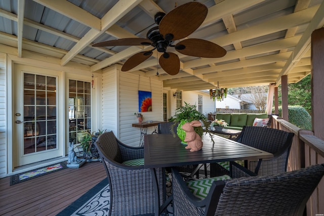 wooden deck featuring a ceiling fan, outdoor dining space, and an outdoor hangout area