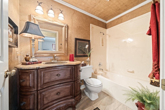 bathroom featuring ornamental molding, vanity, toilet, and shower / bathing tub combination