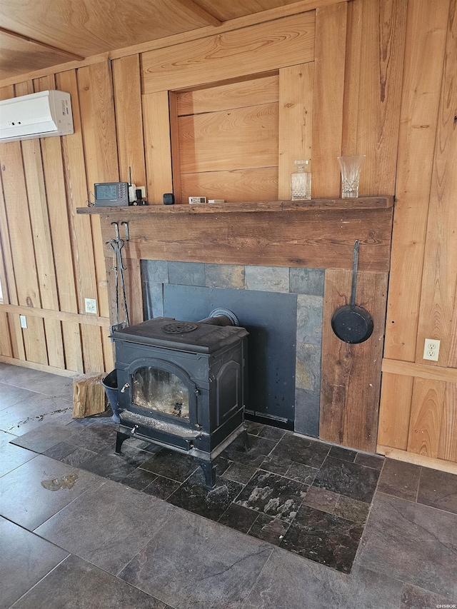 161 Funderburg Rd, Mineral Springs, AR 71851 - interior details featuring wooden walls, an AC wall unit, and a wood stove