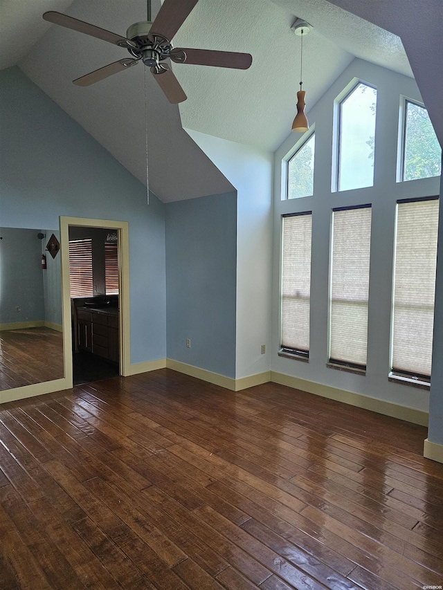 161 Funderburg Rd, Mineral Springs, AR 71851 - unfurnished living room with a ceiling fan, high vaulted ceiling, plenty of natural light, and baseboards