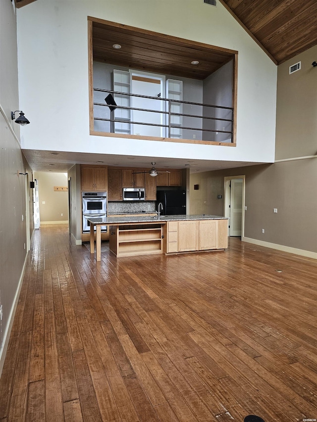 161 Funderburg Rd, Mineral Springs, AR 71851 - interior space featuring wooden ceiling, high vaulted ceiling, baseboards, and dark wood-style floors